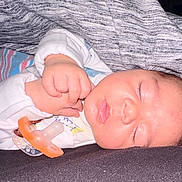 Giovanni is registered to the contest to win money with this photo: baby, sleeping, pacifier, blanket, hand, face, infant, cozy, closeup, soft, peaceful, cute, child, rest, indoor, clothing, newborn, skin, mouth, eyelashes