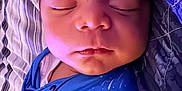 Giovanni joined the competition — help win amazing prizes! baby, sleeping, newborn, blanket, pacifier, blue, face, closeup, peaceful, infant, swaddled, indoors, cozy, portrait, child, soft_light, cute, resting, person, bed