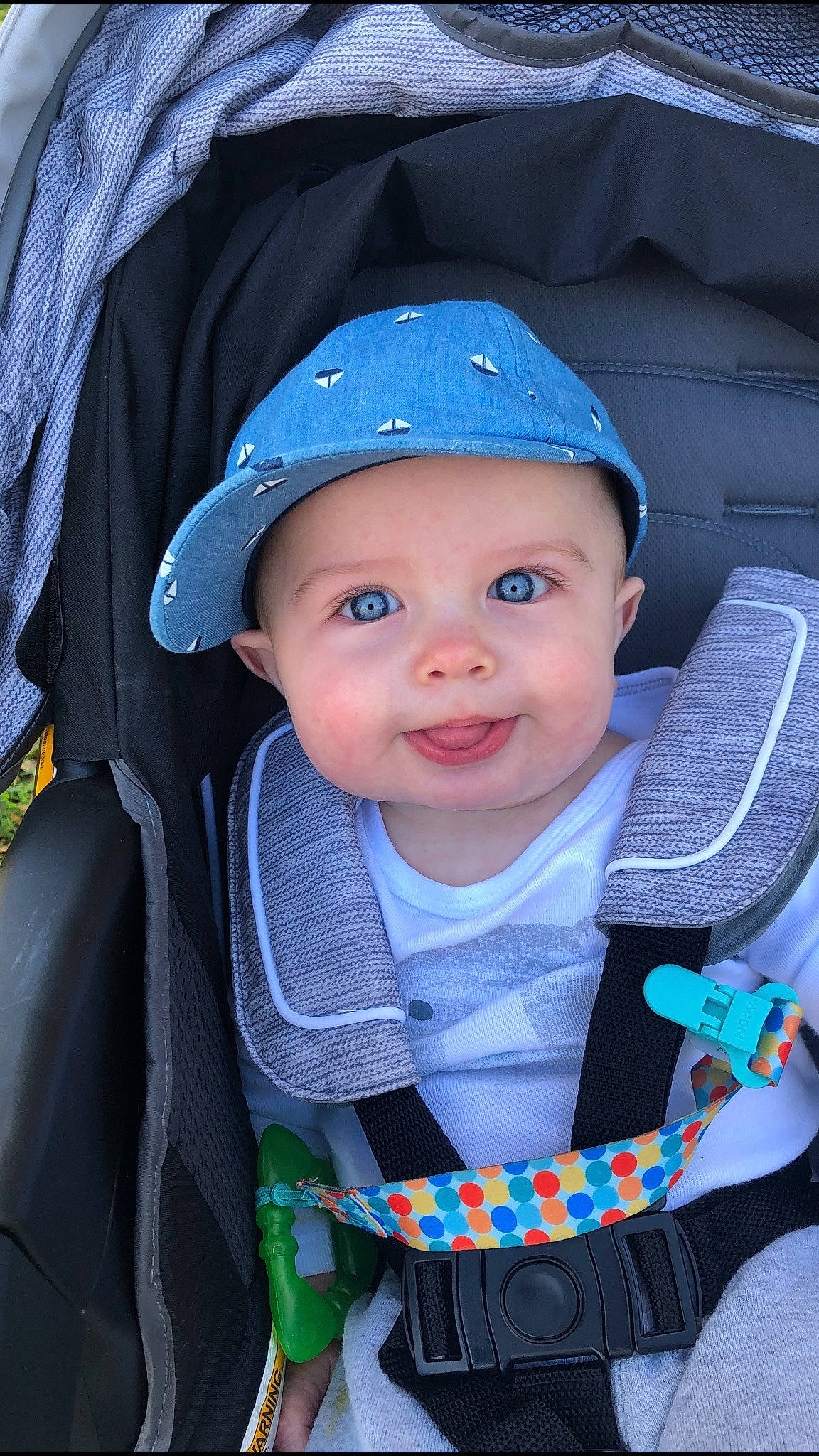 Colin is registered to the contest to win money with this photo: azure, baby, baby_carriage, baby_toddler_clothing, baseball_cap, beauty, blue, cap, chin, cool, cricket_cap, electric_blue, eye, hat, headwear, iris, person, product, smile, snapshot