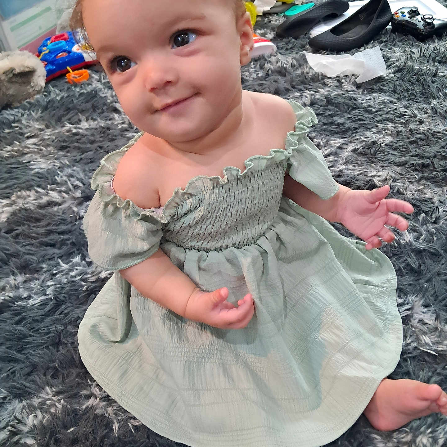 Malalika is registered to the contest to win money with this photo: baby, barefoot, bodypart, clothing, dress, eveningdress, face, finger, footwear, formalwear, hand, happy, head, person, photography, portrait, shoe, sitting, smile, toy
