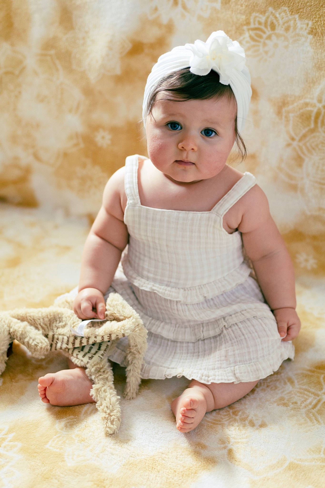 Hope is registered to the contest to win money with this photo: arm, baby, baby_toddler_clothing, cheek, child, dress, embellishment, fashion_accessory, flash_photography, foot, happy, head, headgear, headwear, pattern, person, pink, sitting, skin, sleeve
