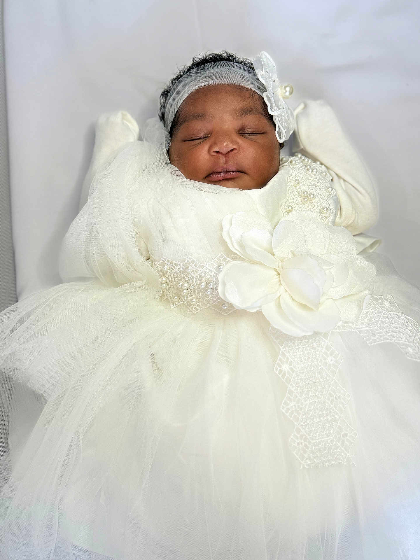Ruth is registered to the contest to win money with this photo: baby, infant, sleeping, dress, white_dress, headband, flower, pearls, tulle, lace, cute, adorable, portrait, peaceful, sleep, child, newborn, soft, fabric, clothing