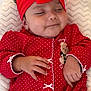baby, infant, sleeping, red_headband, red_clothing, polka_dots, hand, blanket, cute, indoors, portrait, child, soft_texture, peaceful, toddler, headwear, cozy, sleep, small_baby, holiday