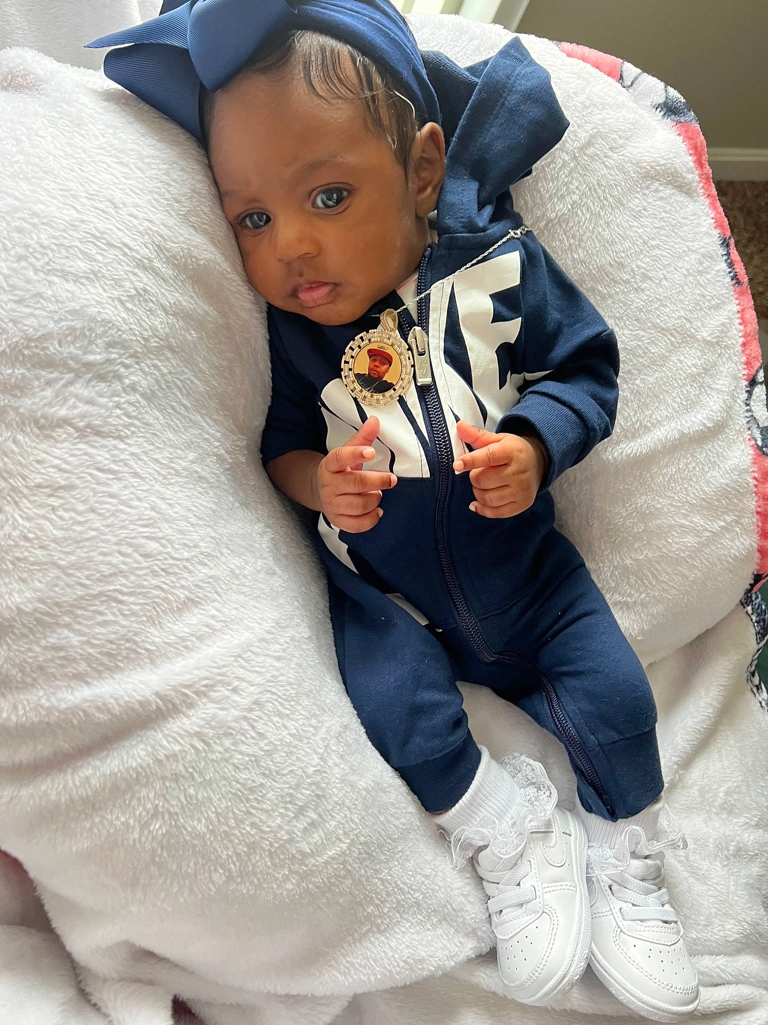 Amiri is registered to the contest to win money with this photo: baby, baby_carriage, baby_products, baby_toddler_clothing, cap, child, comfort, electric_blue, fashion_accessory, fun, gesture, happy, hat, lap, person, sitting, sleeve, sock, thumb, toddler