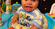 Torrin joined the competition — help win amazing prizes! activity_center, baby, baby_toy, backwards_cap, cap, child, clothing, colorful, eyes, face, happy, indoor, infant, photograph, playroom, portrait, seated, smiling, striped_shirt, teething