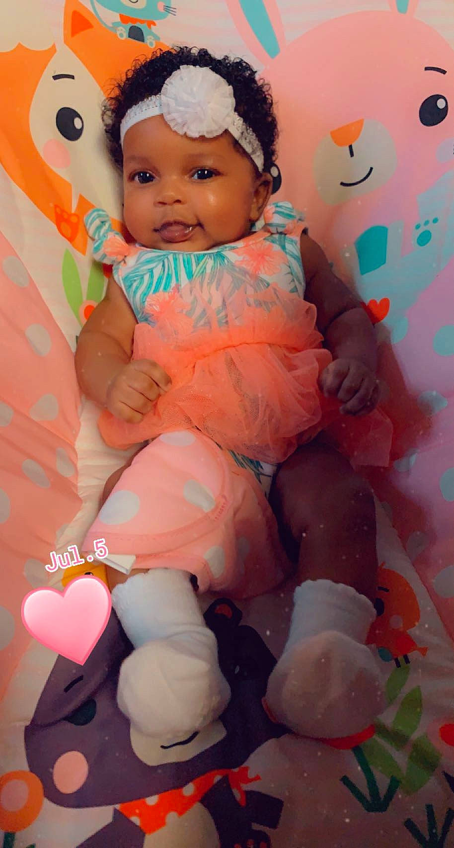 Kassidy is registered to the contest to win money with this photo: baby, baby_toddler_clothing, beauty, cap, cheek, eye, face, fun, happy, head, headwear, magenta, orange, pattern, person, pink, product, skin, textile, thigh