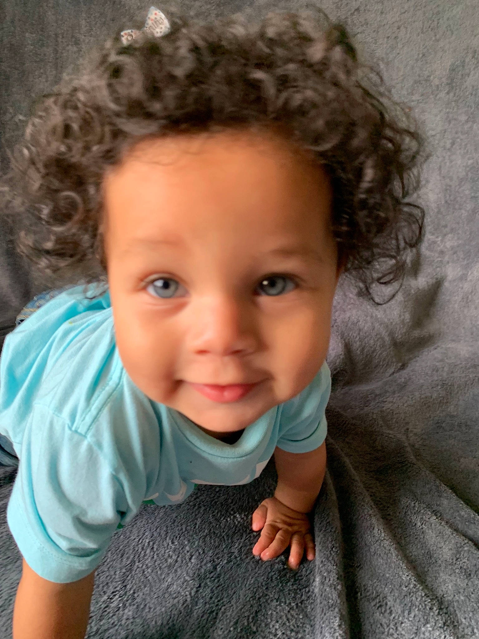 Bryson is registered to the contest to win money with this photo: baby, brown_hair, cheek, child, child_model, chin, eye, face, forehead, hair, hairstyle, head, human, joy, lip, long_hair, nose, person, photography, skin