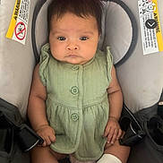 Adalia joined the competition — help win amazing prizes! baby, child, infant, car_seat, green_clothing, socks, pink, gray, seat_belt, hair, face, looking_at_camera, indoors, cute, comfortable, sitting, young_child, apparel, person, portrait