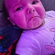 Kaizen joined the competition — help win amazing prizes! baby, infant, face, expression, purple_light, blanket, clothing, onesie, lying_down, skin, cute, child, indoors, portrait, texture, fabric, colorful, young, human, toddler
