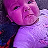 baby, infant, face, expression, purple_light, blanket, clothing, onesie, lying_down, skin, cute, child, indoors, portrait, texture, fabric, colorful, young, human, toddler