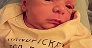 Tyson joined the competition — help win amazing prizes! baby, baby_clothes, closeup, clothing, cute, eyes_open, fabric, face, head, human, indoors, infant, lap, newborn, person, portrait, resting, skin, soft_lighting, yellow_outfit