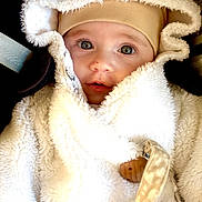 Lou participe au concours pour gagner de l'argent avec cette photo : baby, infant, face, hood, coat, fluffy, warm_clothing, child, cute, closeup, portrait, eyes, winter, bundle_up, soft_texture, hat, newborn, person, baby_clothes, snug