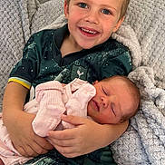 Charley joined the competition — help win amazing prizes! child, baby, smiling, sleeping, blanket, couch, cozy, indoors, portrait, family, love, comfort, happy, toddler, newborn, clothing, holding, blue_eyes, soft_texture, home