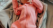 Victoria is registered to the contest to win money with this photo: newborn, baby, sleeping, pink_outfit, bow_hat, blanket, hospital_bassinet, cozy, infant, child, bed, soft_texture, portrait, indoors, peaceful, cute, wrapped, clothing, person, rest