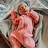 newborn, baby, sleeping, pink_outfit, bow_hat, blanket, hospital_bassinet, cozy, infant, child, bed, soft_texture, portrait, indoors, peaceful, cute, wrapped, clothing, person, rest