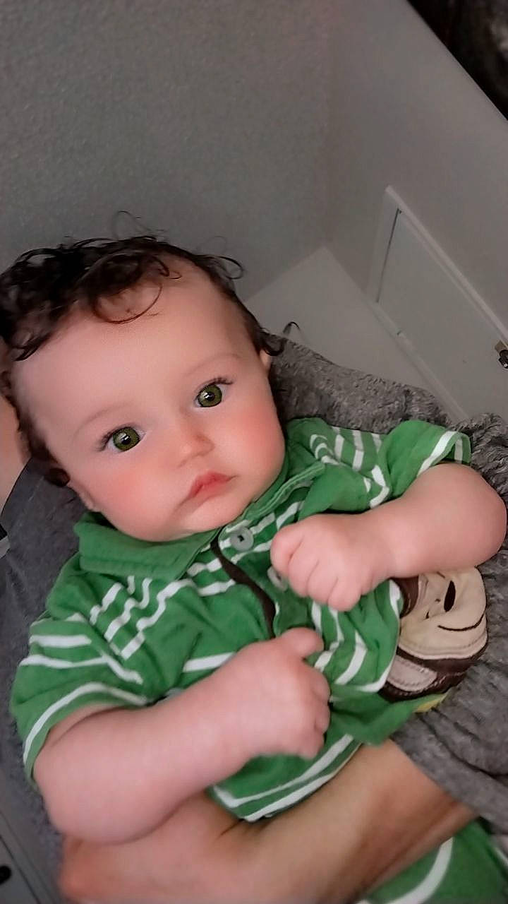 Mesiyah is registered to the contest to win money with this photo: baby, baby_toddler_clothing, cheek, child, comfort, elbow, finger, foot, hand, human_leg, nail, nose, pattern, person, sitting, skin, sleeve, sock, thumb, toddler