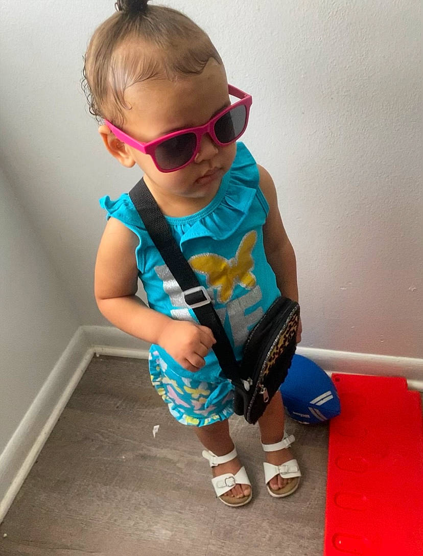 Kahlani is registered to the contest to win money with this photo: baby_toddler_clothing, child, cool, electric_blue, eyewear, glasses, goggles, happy, joint, neck, person, personal_protective_equipment, shoe, shorts, sleeve, sportswear, sunglasses, t_shirt, toddler, vision_care