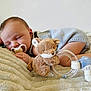 baby, sleeping, pacifier, plush_toy, blanket, infant, cute, soft, cozy, newborn, child, resting, peaceful, indoors, clothing, toddler, lying_down, comfort, toy, bed
