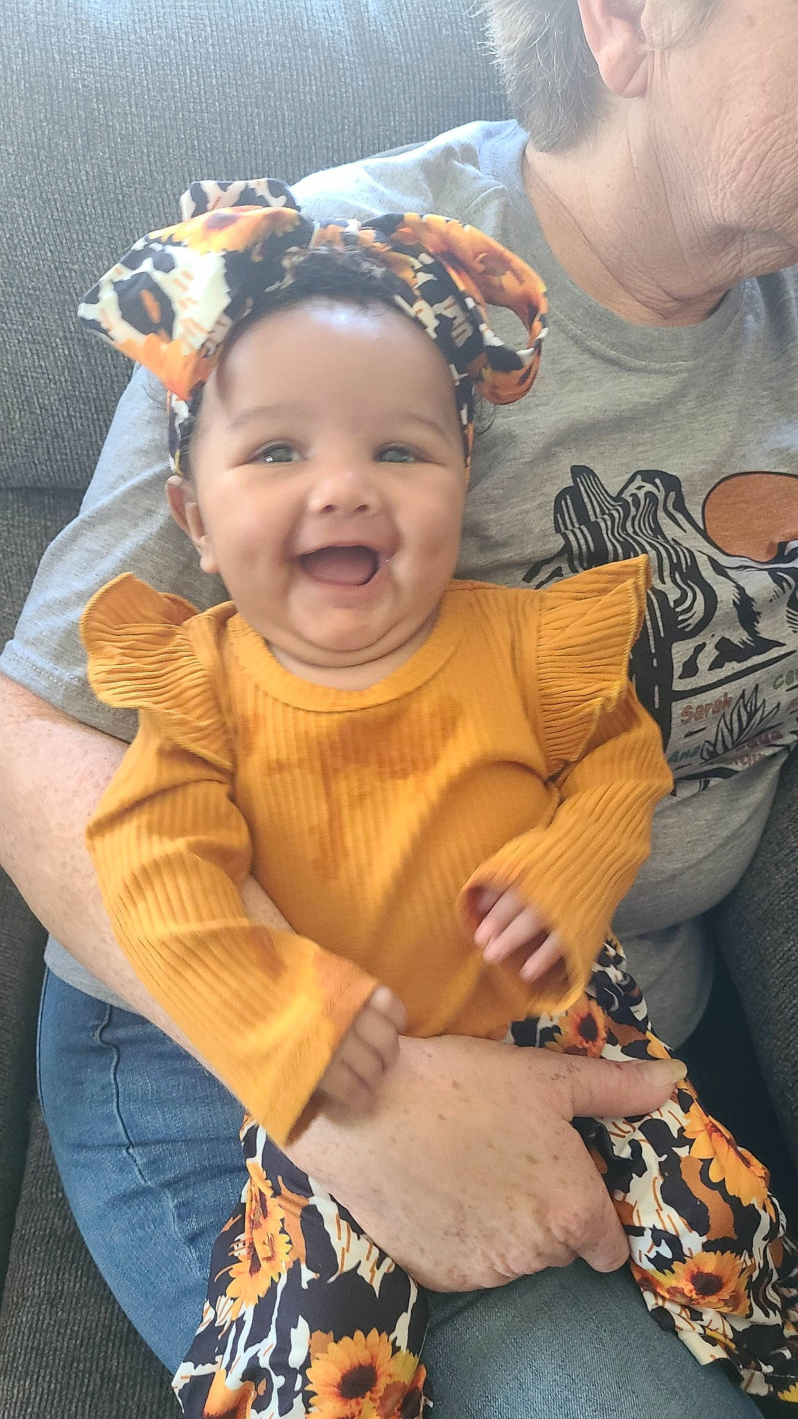 Leilani joined the competition — help win amazing prizes! baby, baby_toddler_clothing, clothing, cool, event, face, fashion_accessory, fun, gesture, grass, hairstyle, happy, headwear, jewellery, joy, necklace, person, sitting, skin, sleeve