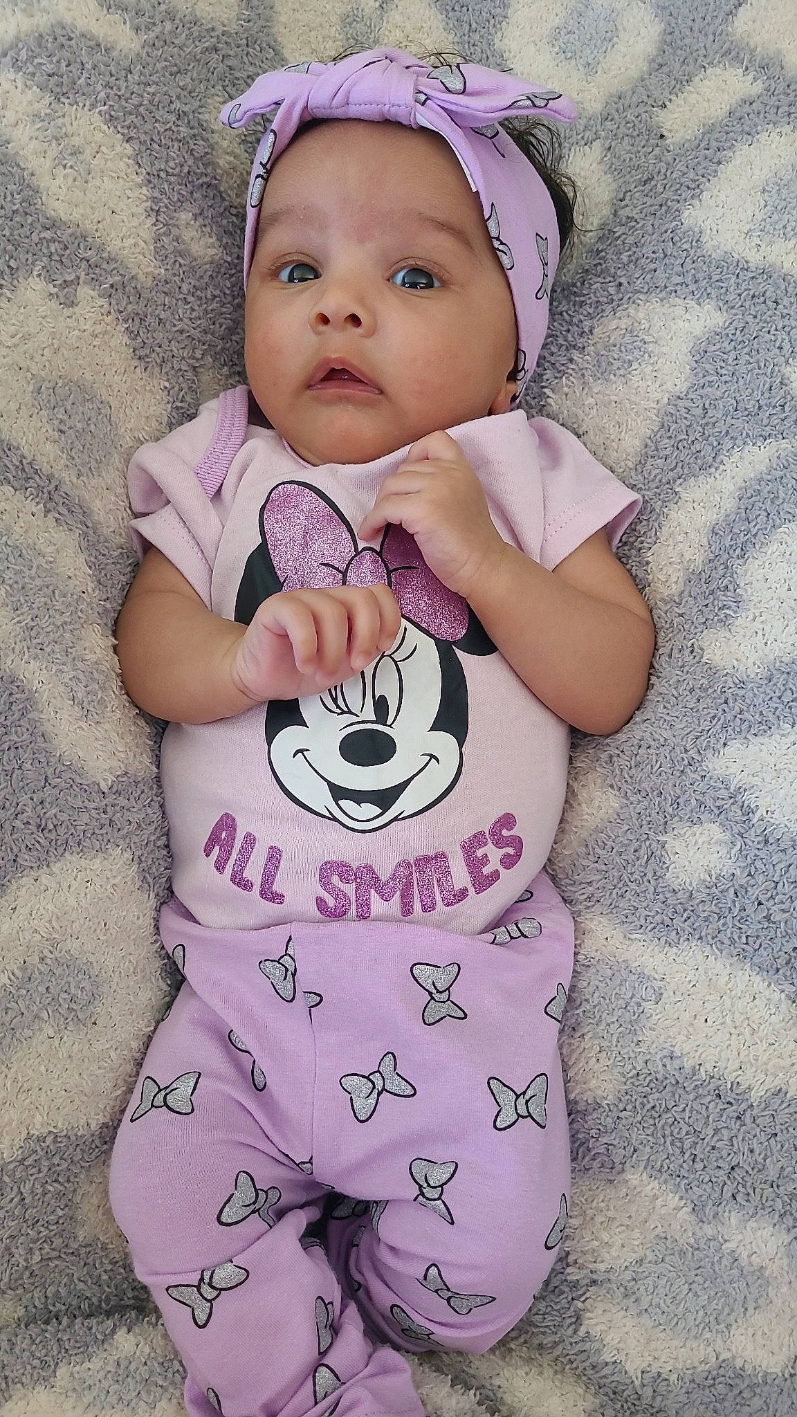 Leilani joined the competition — help win amazing prizes! baby, baby_toddler_clothing, cap, cheek, child, cool, eye, face, hand, happy, head, headwear, pattern, person, pink, product, purple, skin, sleeve, textile