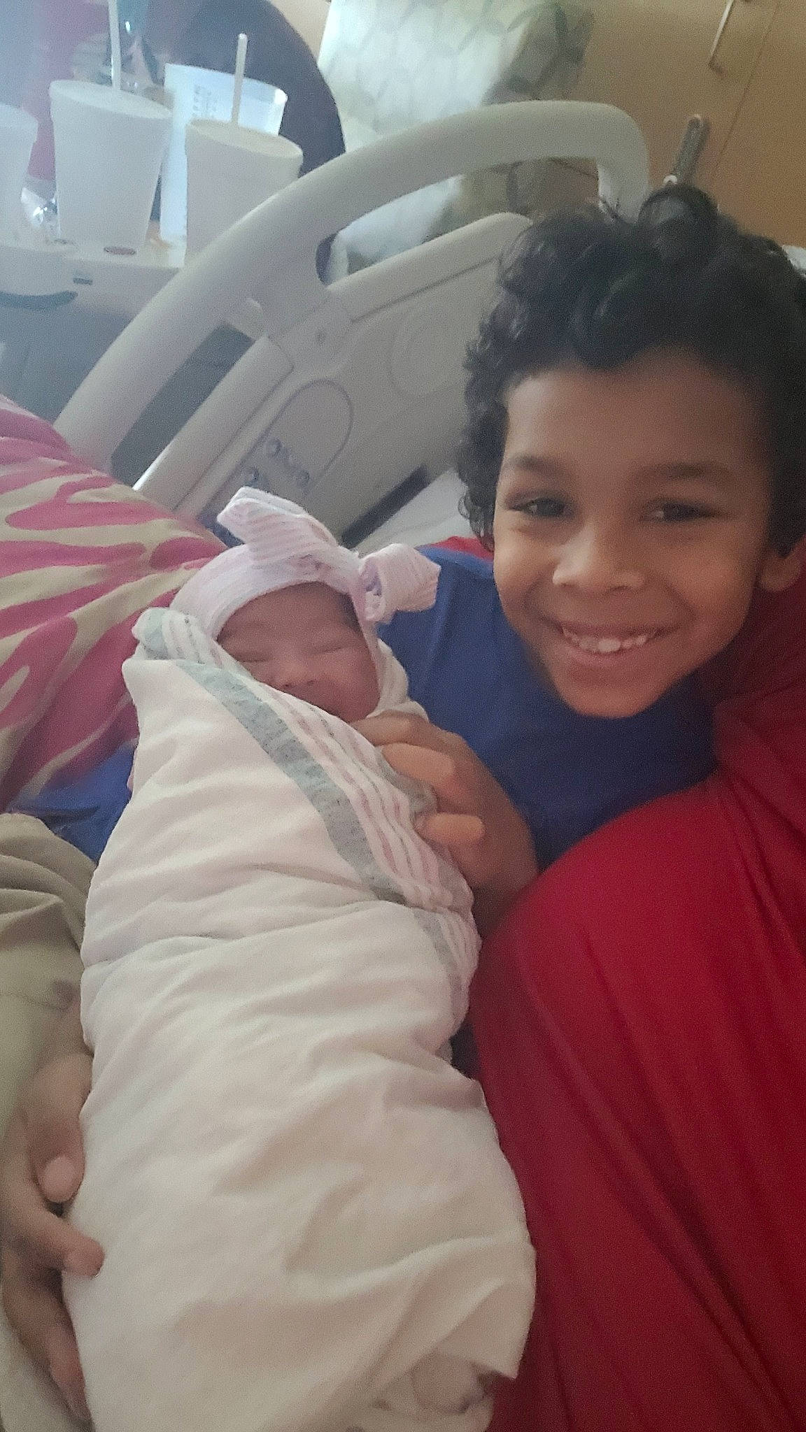 Izaiah is registered to the contest to win money with this photo: baby, child, comfort, event, family_car, fun, happy, hat, head, joy, linens, mouth, person, room, skin, smile, t_shirt, thumb, toddler, travel