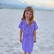 Rhegan is registered to the contest to win money with this photo: child, girl, beach, sand, sea, ocean, sky, clouds, dress, barefoot, smile, blond_hair, portrait, outdoor, summer, vacation, young, happy, casual_clothing, nature