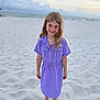 barefoot, beach, blond_hair, casual_clothing, child, clouds, dress, girl, happy, nature, ocean, outdoor, portrait, sand, sea, sky, smile, summer, vacation, young