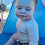baby, child, beach, tent, blue, umbrella, sand, summer, sunlight, outdoor, swimwear, sitting, cute, skin, expression, vacation, relaxation, holiday, closeup, portrait