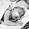 Sienna participe au concours pour gagner de l'argent avec cette photo : baby, black_and_white, blanket, cute, face, fragile, hand, healthcare, hospital, indoors, infant, medical_equipment, nasal_cannula, newborn, pattern, peaceful, resting, skin, sleeping, wrapped