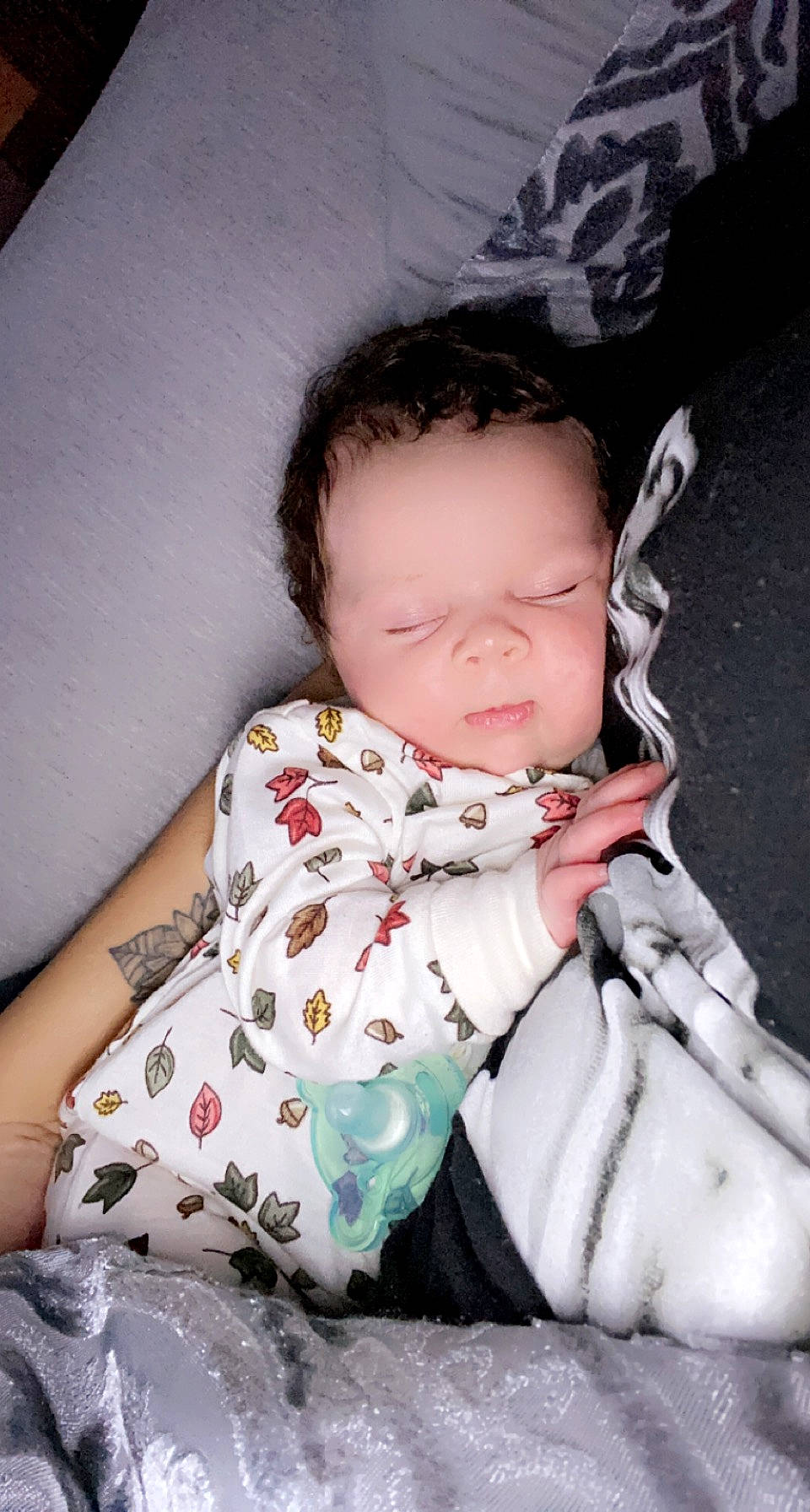 Sage is registered to the contest to win money with this photo: arm, baby, baby_toddler_clothing, cheek, child, comfort, eye, eyelash, finger, flash_photography, hairstyle, hand, happy, lip, neck, pattern, person, sitting, skin, sleeve