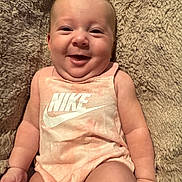 Anastasia joined the competition — help win amazing prizes! baby, smile, onesie, nike, peach, blanket, infant, cute, happy, skin, face, arm, hand, leg, soft, texture, lying, clothing, person, portrait