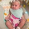 baby, infant, headband, bow, bib, sitting, cushion, patterned, clothing, pink, white, sock, drool, cute, face, person, indoor, child, seat, happy