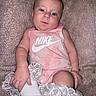 Anastasia joined the competition — help win amazing prizes! baby, infant, pink_clothing, nike_logo, socks, frilly_socks, blanket, texture, cute, child, portrait, indoor, person, small_hand, legs, expression, relaxing, soft, casual, young