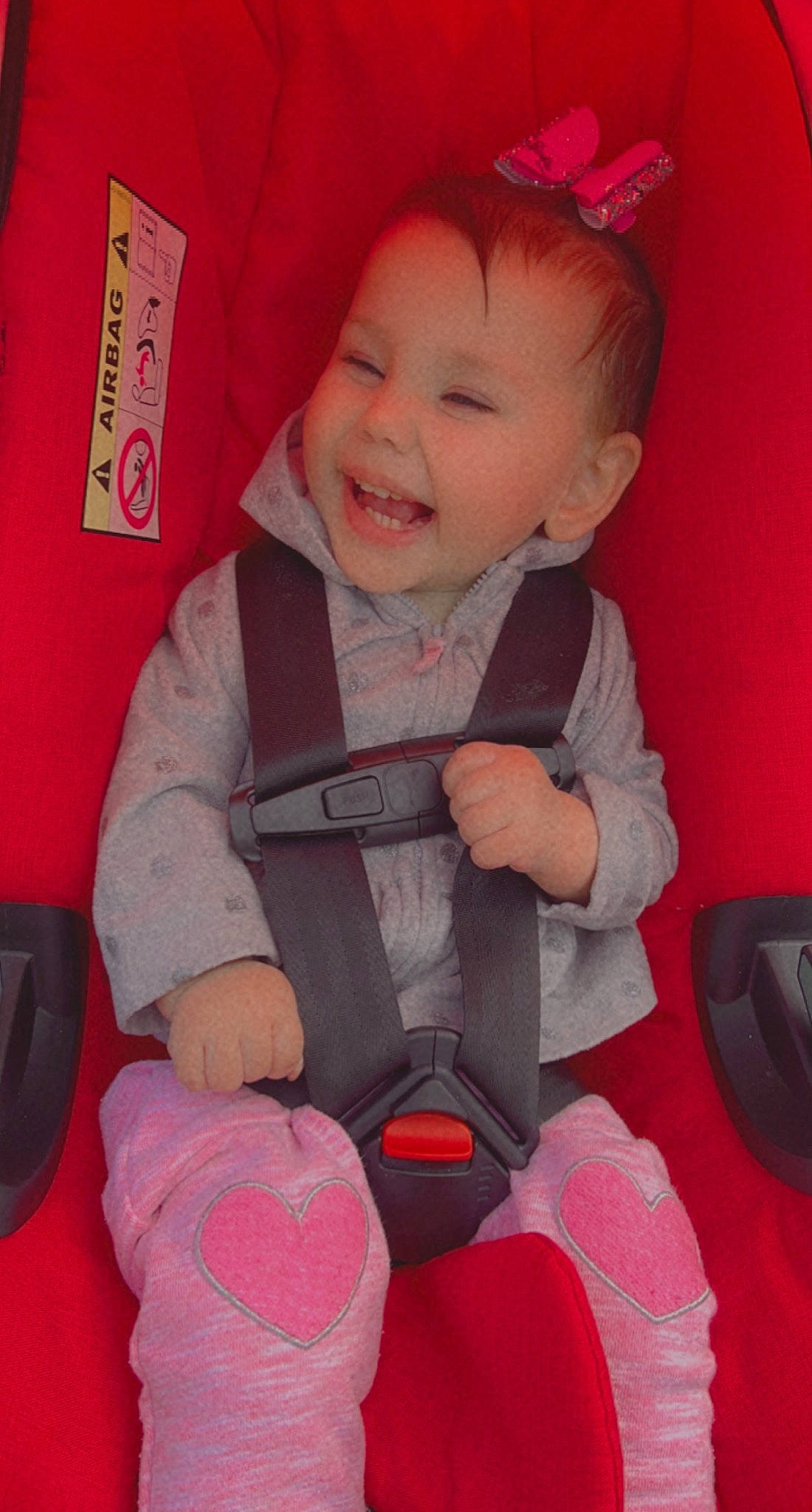 Amya is registered to the contest to win money with this photo: baby, baby_carriage, baby_toddler_clothing, beauty, cap, cheek, child, comfort, eye, happy, human_body, magenta, person, pink, red, sitting, skin, sleeve, smile, snapshot