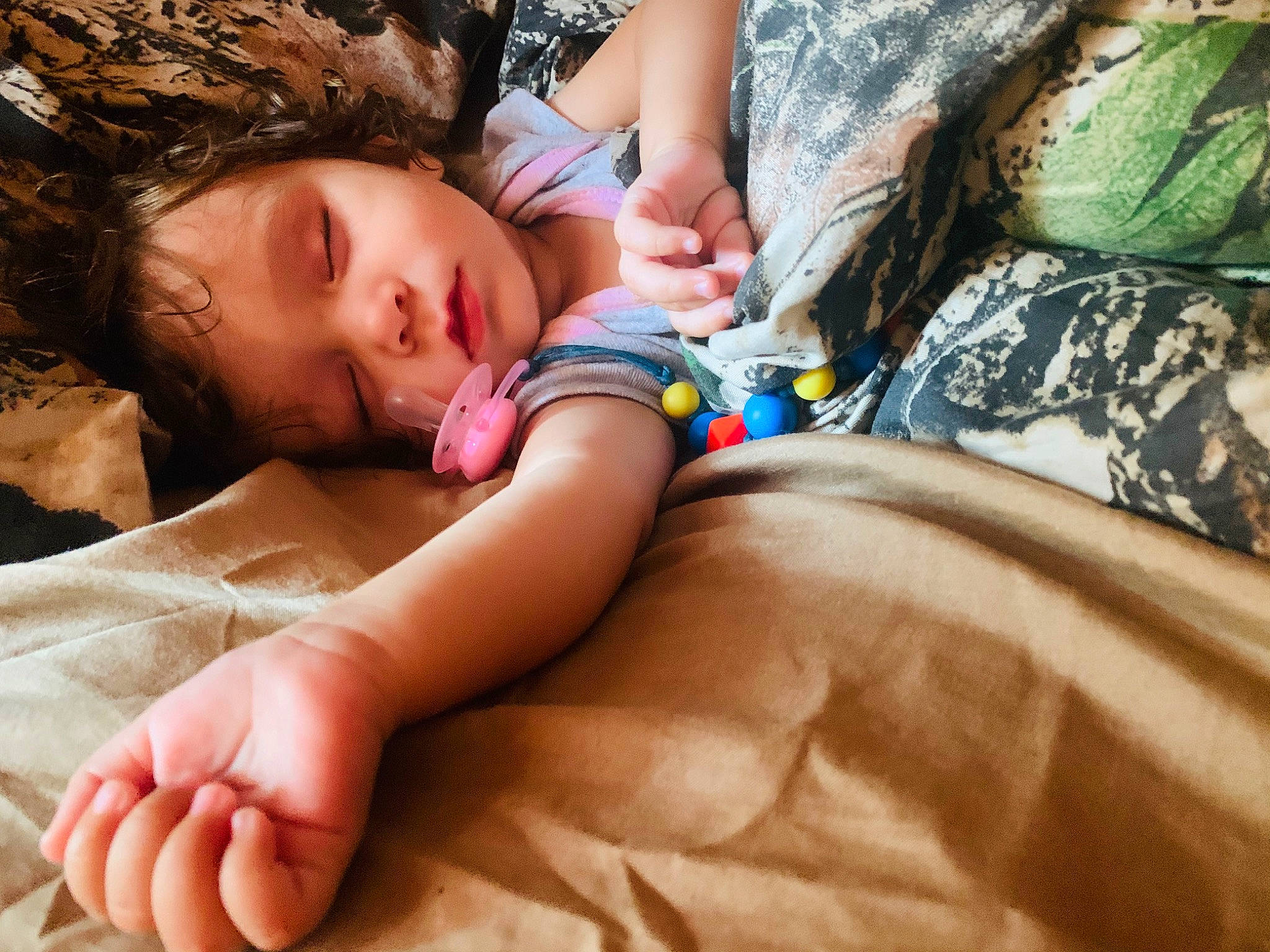 Holly is registered to the contest to win money with this photo: child, finger, hand, leg, nap, person, sleep