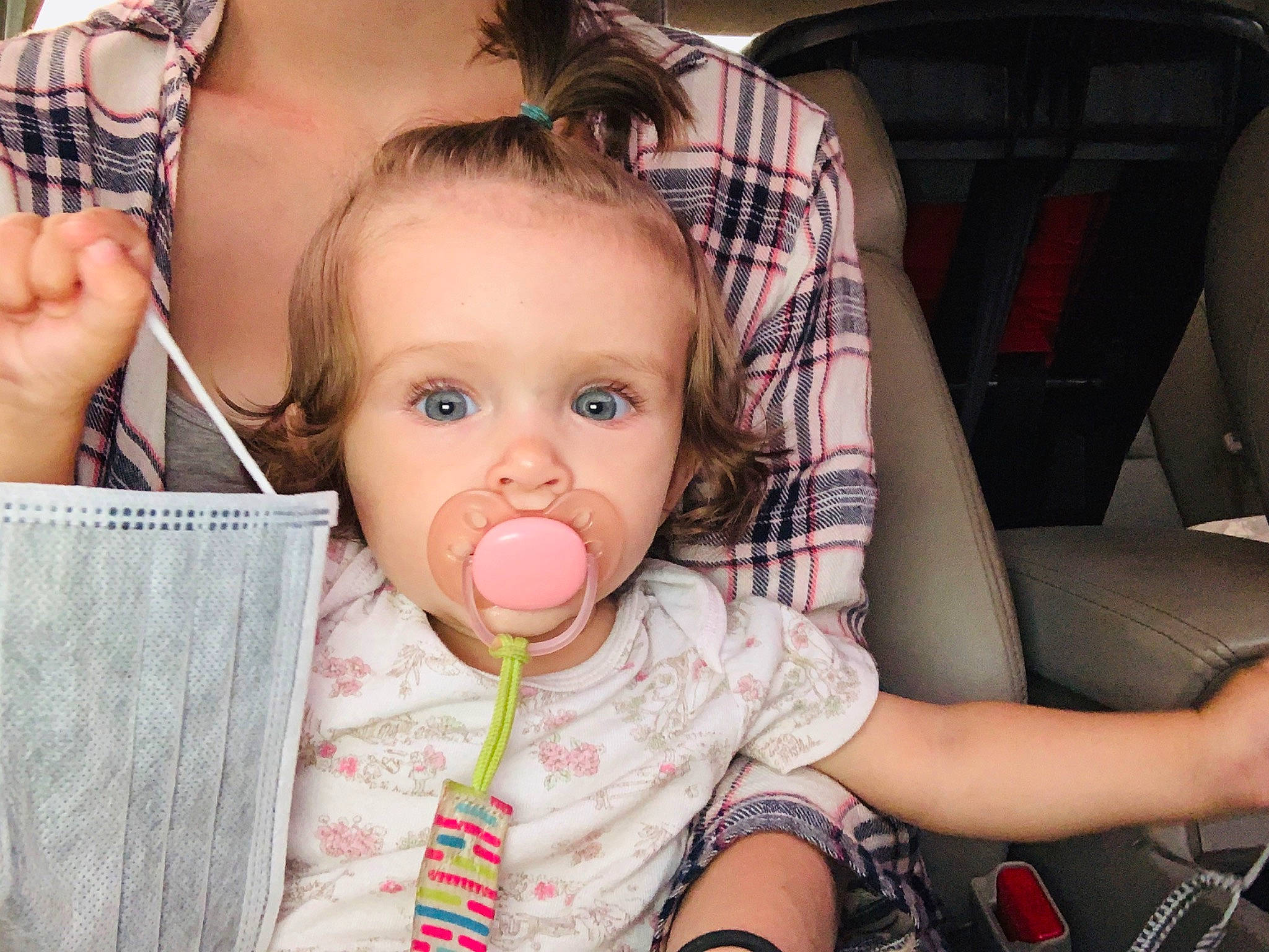Holly is registered to the contest to win money with this photo: baby, car_seat, cheek, child, face, finger, hand, lip, mouth, nose, pattern, person, product, skin, toddler, tongue