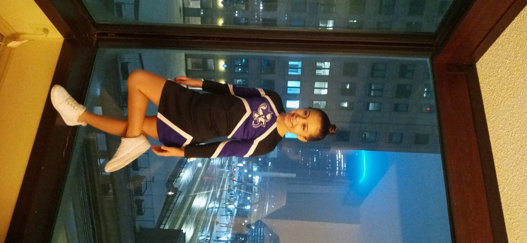 Mya is registered to the contest to win money with this photo: building, display_device, electric_blue, entertainment, event, fun, glass, human_leg, joy, led_backlit_lcd_display, performance, person, recreation, room, sportswear, thigh, window