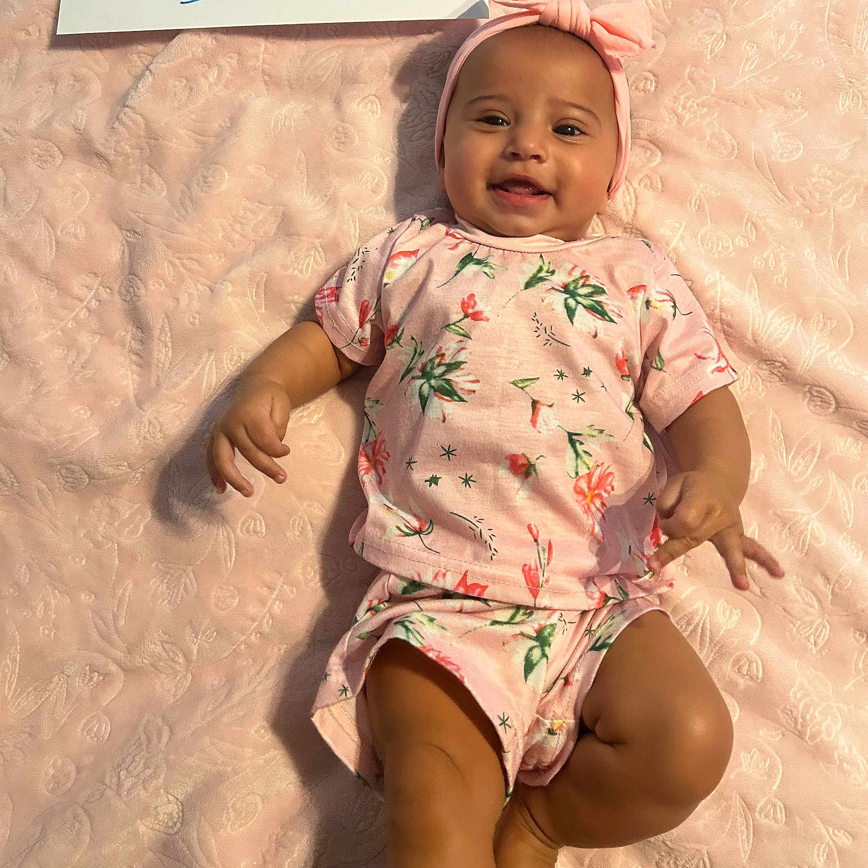 Delilah joined the competition — help win amazing prizes! baby, babylaughing, beachwear, clothing, face, happy, head, person, sitting, sleeve, smile, standing