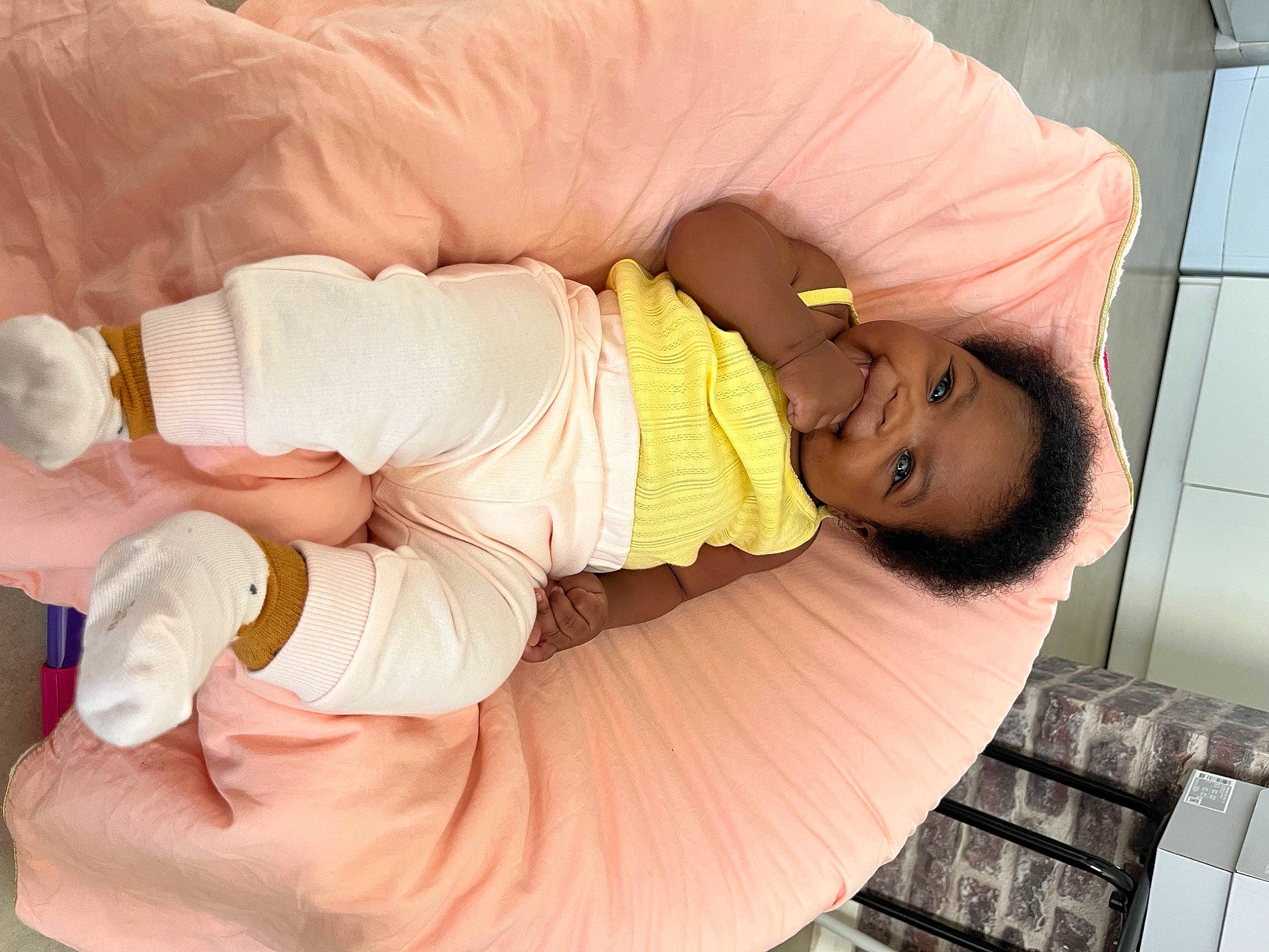 Lina participe au concours pour gagner de l'argent avec cette photo : abdomen, baby, baby_products, baby_sleeping, baby_toddler_clothing, child, comfort, flooring, foot, hand, human_body, human_leg, joy, knee, leg, linens, person, skin, sock, thigh