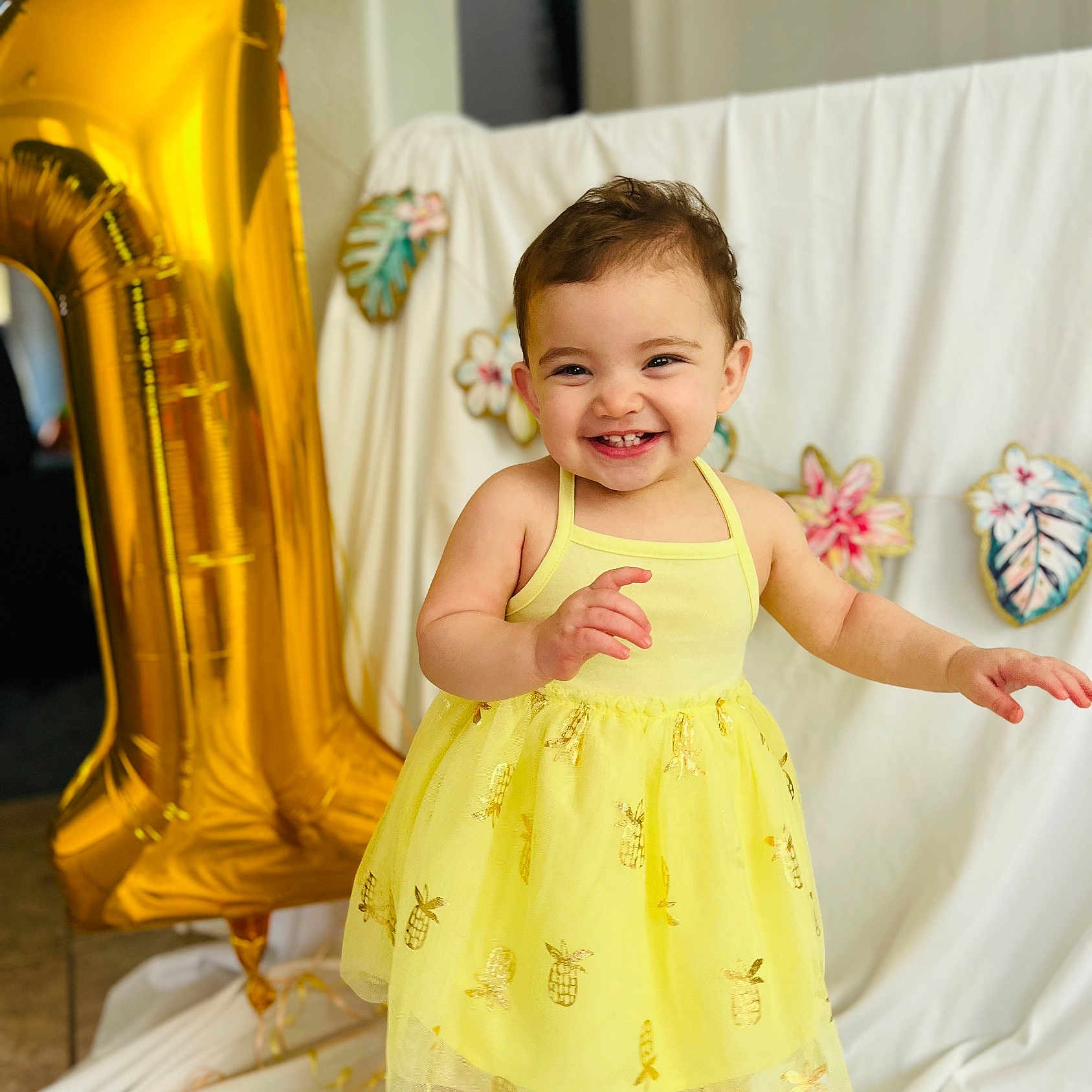 Layla is registered to the contest to win money with this photo: baby, balloon, clothing, costume, couch, cushion, dress, eveningdress, face, formalwear, furniture, happy, head, homedecor, indoors, laughing, person, photography, portrait, smile