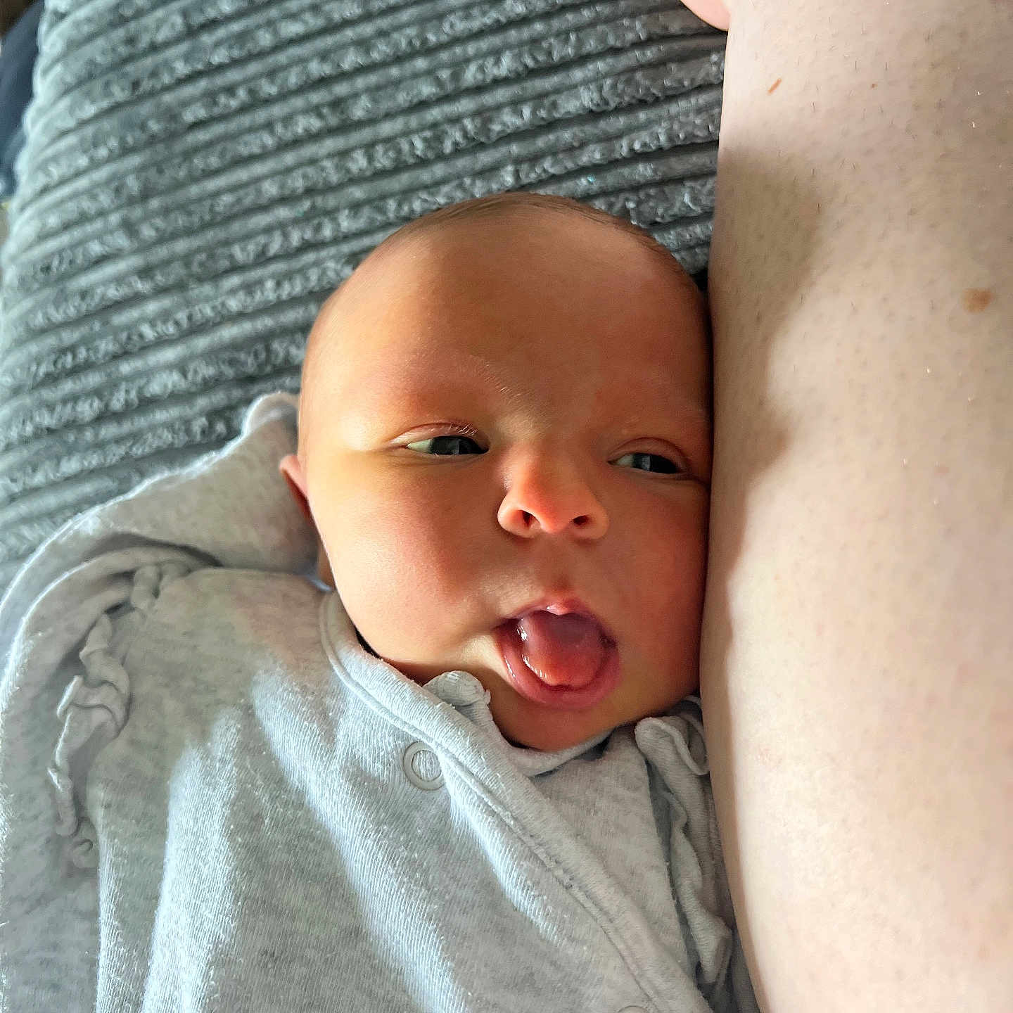 Adaline is registered to the contest to win money with this photo: baby, bed, bodypart, clothing, cushion, face, furniture, head, homedecor, mouth, newborn, person, photography, portrait, quilt, selfie, sleeping, t_shirt, tongue, yawning