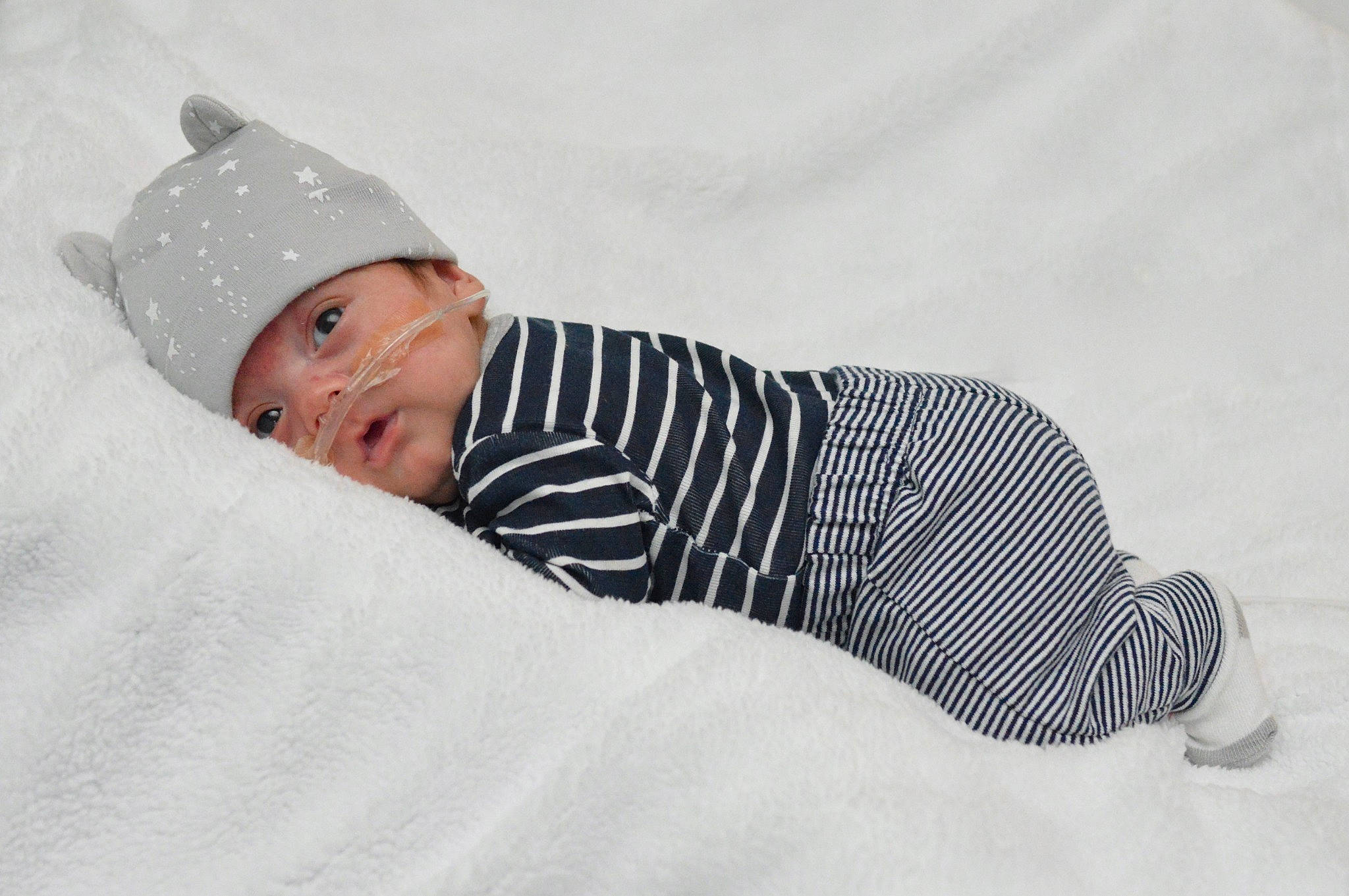 Manuel joined the competition — help win amazing prizes! baby, baby_toddler_clothing, cap, child, comfort, elbow, event, happy, hat, headgear, headwear, human_leg, knee, linens, pattern, person, portrait_photography, room, sitting, sleeve