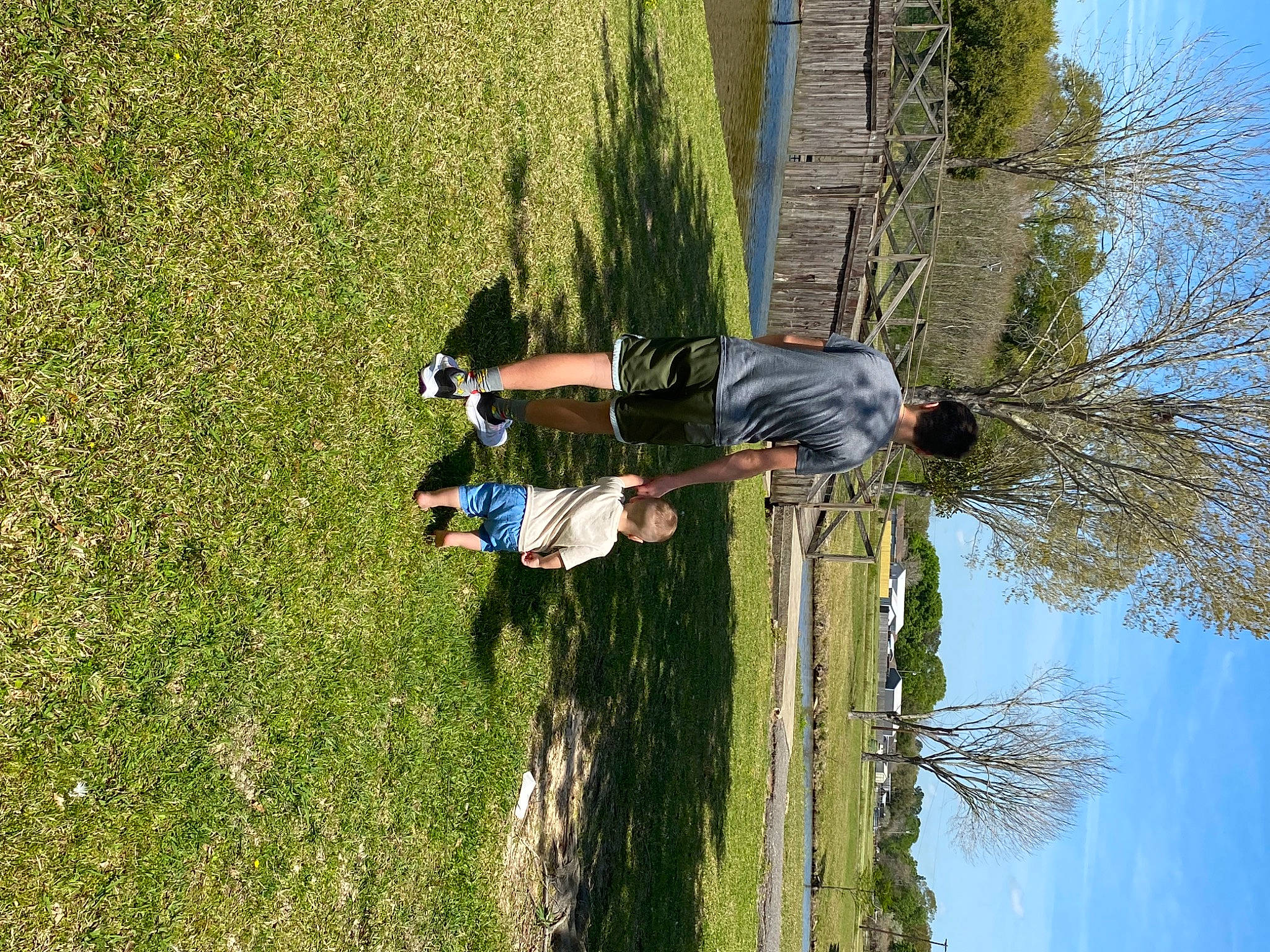 Graham joined the competition — help win amazing prizes! adventure, fun, grass, grassland, landscape, leisure, line, pasture, people_in_nature, plant, recreation, shadow, shrub, sky, tree, trunk