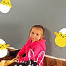 Denver joined the competition — help win amazing prizes! child, girl, pink_hoodie, floor, wood_floor, gray_wall, easter, cartoon_chick, cartoon_egg, text_overlay, holiday, festive, bunny_ears, sitting, indoors, casual_clothing, young_child, cute, smiling, playful