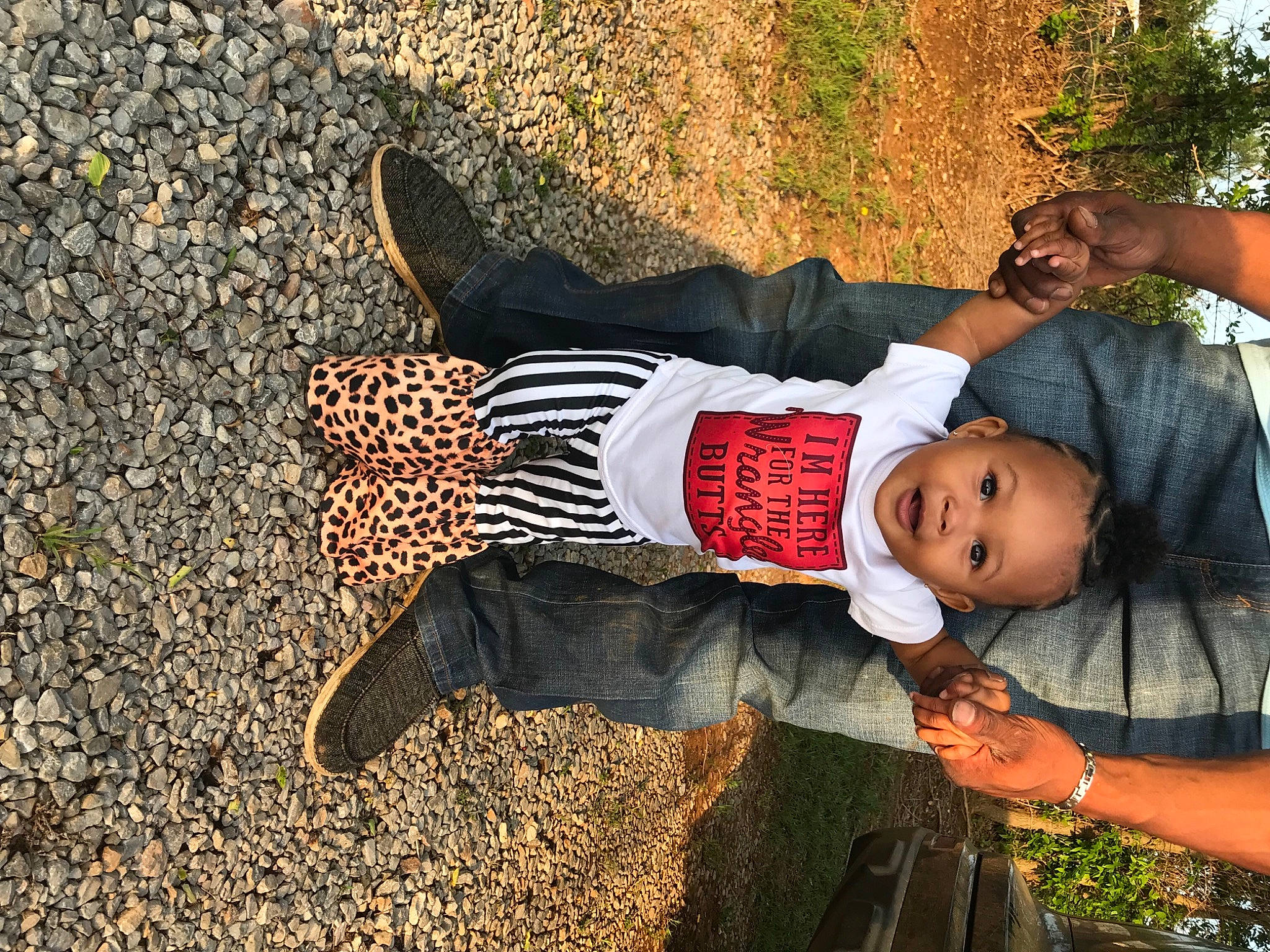 Aniyah joined the competition — help win amazing prizes! arm, baby, child, flash_photography, fun, grass, hairstyle, happy, hat, human_leg, leaf, leisure, people_in_nature, person, shadow, sitting, soil, t_shirt, toddler, travel