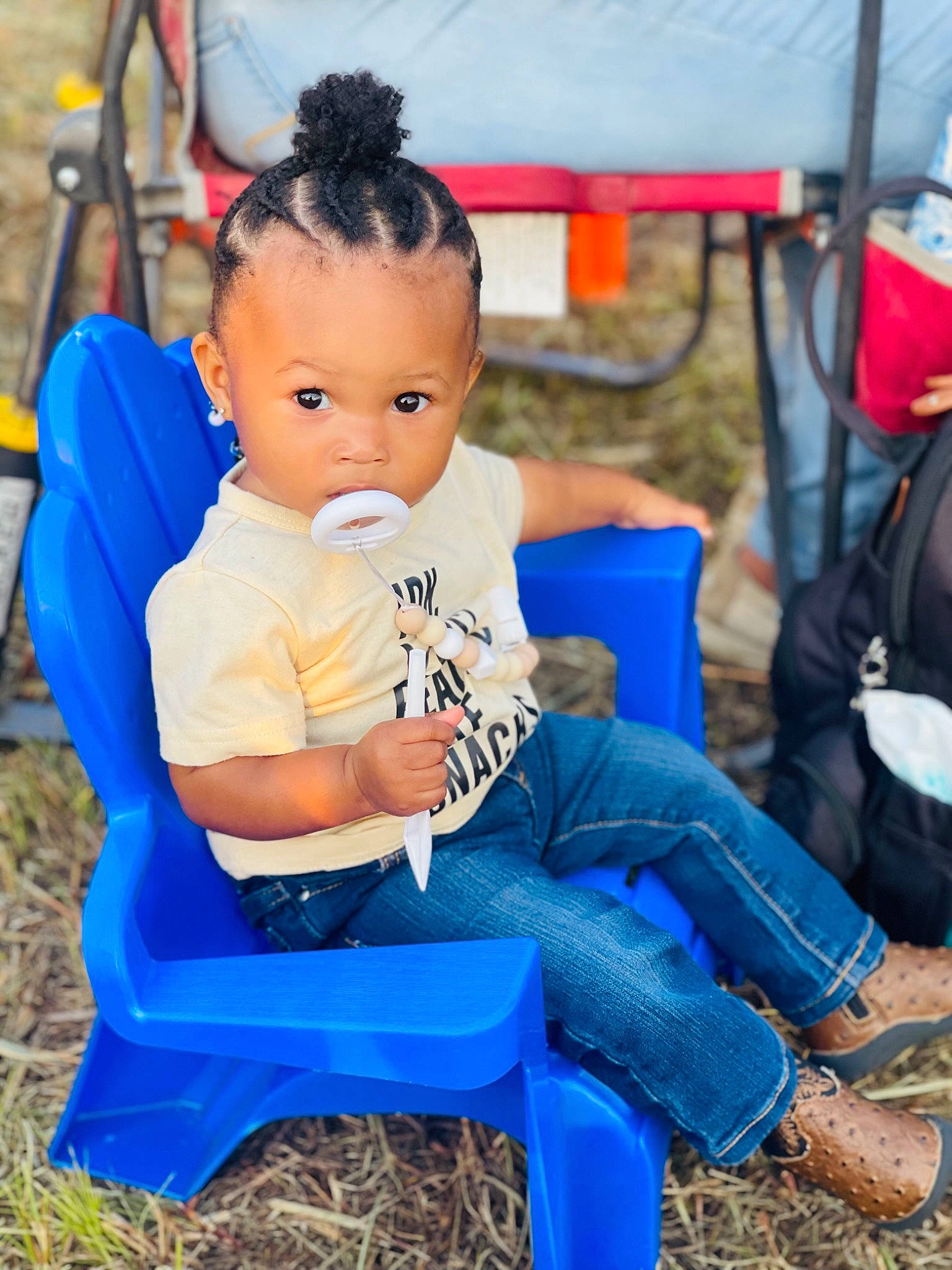 Aniyah joined the competition — help win amazing prizes! baby, baby_toddler_clothing, blue, chair, child, city, electric_blue, fun, grass, hairstyle, happy, leisure, person, photograph, recreation, sitting, sneakers, soil, tent, toddler