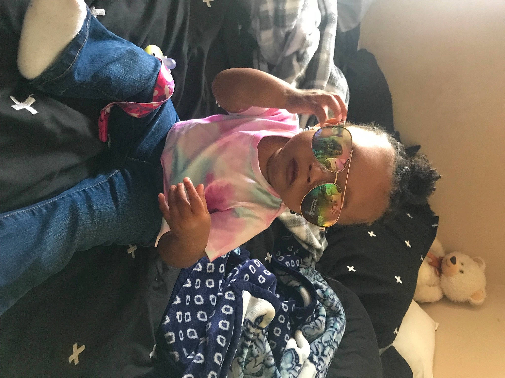 Aniyah joined the competition — help win amazing prizes! baby, child, comfort, event, eyewear, finger, fun, gesture, glasses, happy, hat, headgear, interaction, jewellery, mouth, nail, person, sitting, sunglasses, toddler