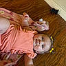 Brynleigh joined the competition — help win amazing prizes! baby, child, girl, floor, wooden_floor, blanket, pink_blanket, toy_car, orange_outfit, hair_bows, yellow_bows, smiling, lying_down, indoors, cute, infant, happy, playful, casual, comfortable