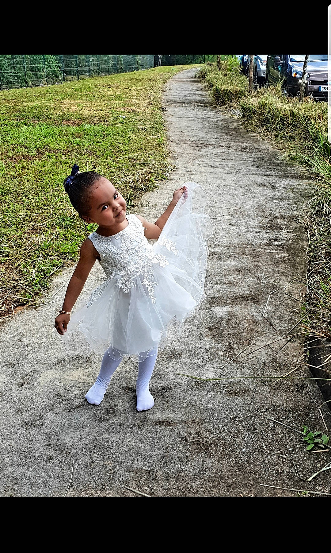 Chrysliane-maëlly participe au concours pour gagner de l'argent avec cette photo : asphalt, bridal_accessory, bridal_clothing, dance, dress, event, flash_photography, fun, gesture, grass, grass_family, grassland, happy, joy, lawn, leisure, people_in_nature, person, plant, recreation