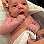Lukia Saint is registered to the contest to win money with this photo: baby, infant, bath, water, hands, towel, skin, wet, cute, child, person, human, expression, face, newborn, care, parent, closeup, bathroom, comfort